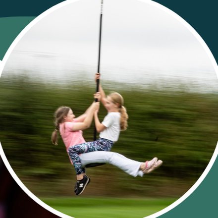 Two girls sharing a zipwire ride at the Connect Weekend Away