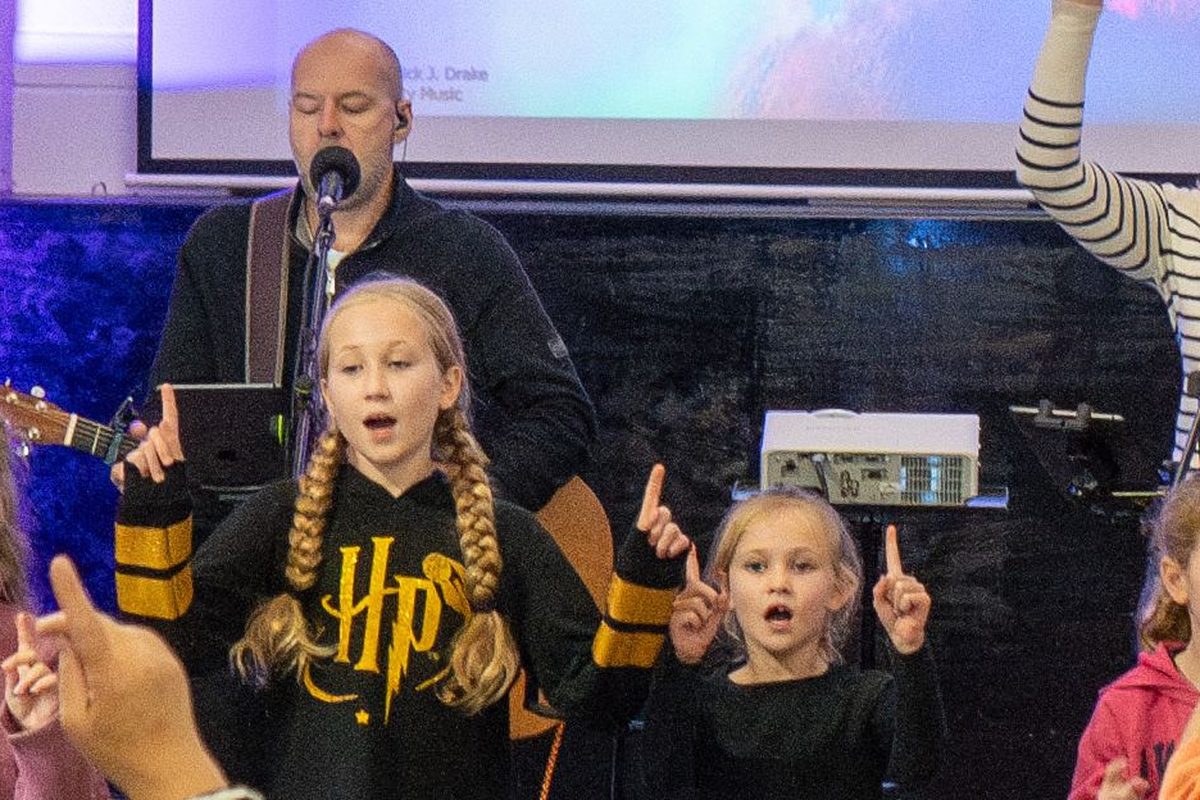 Children and the worship band leading songs at a Connect Gamston service